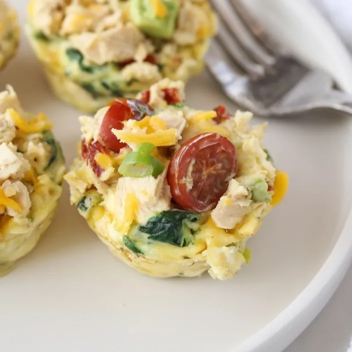 Golden baked Avocado Ranch Chicken Egg Cups, cheesy and savory for meal prep.