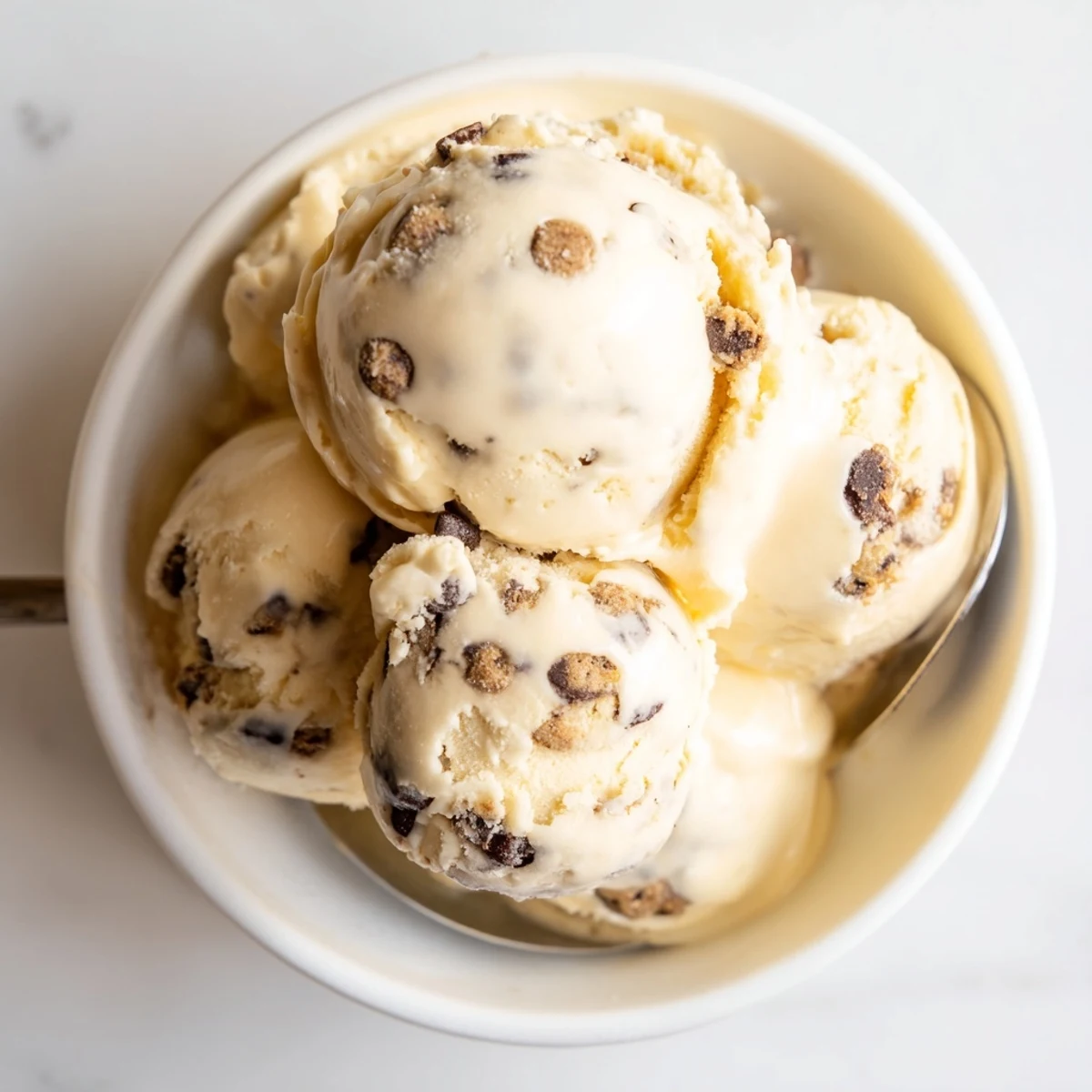 Creamy cottage cheese ice cream with rich cookie dough bites, a delightful dessert.  