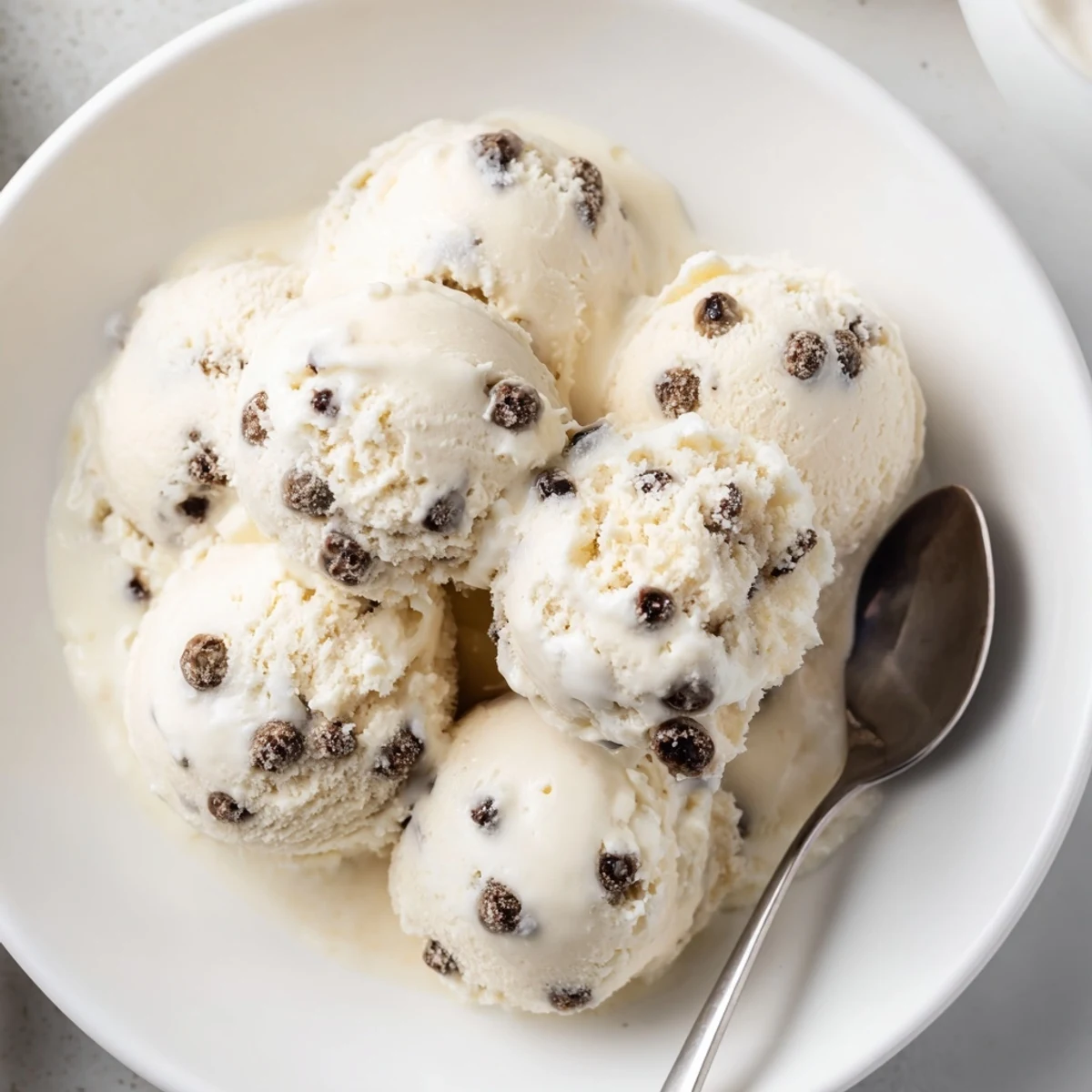 Guilt-free cottage cheese ice cream topped with chewy cookie dough for a tasty treat.