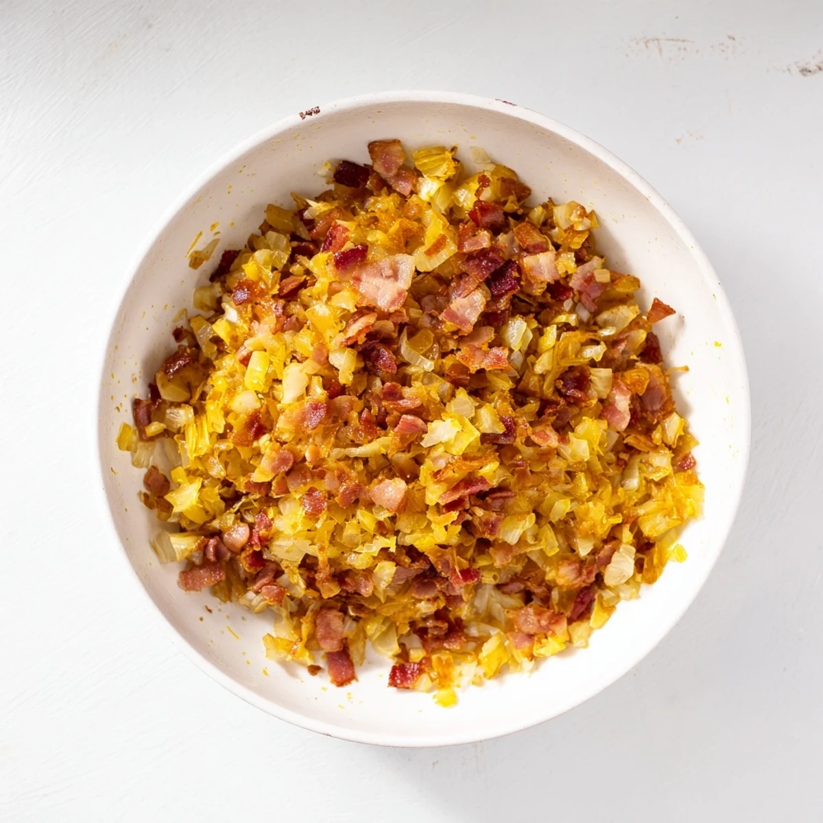 Smoky bacon and sweet caramelized onion dip, ready to be served, chilled and flavorful.