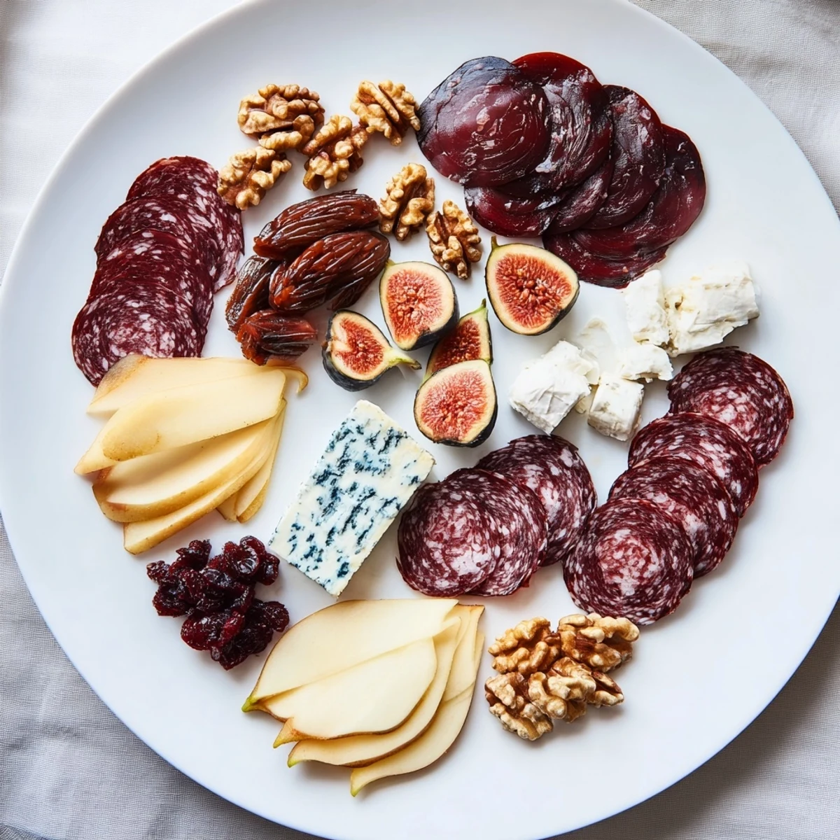 Beautifully arranged Majestic Venison Charcuterie Platter, pairing cured meats with fruit and nuts, ready to serve.