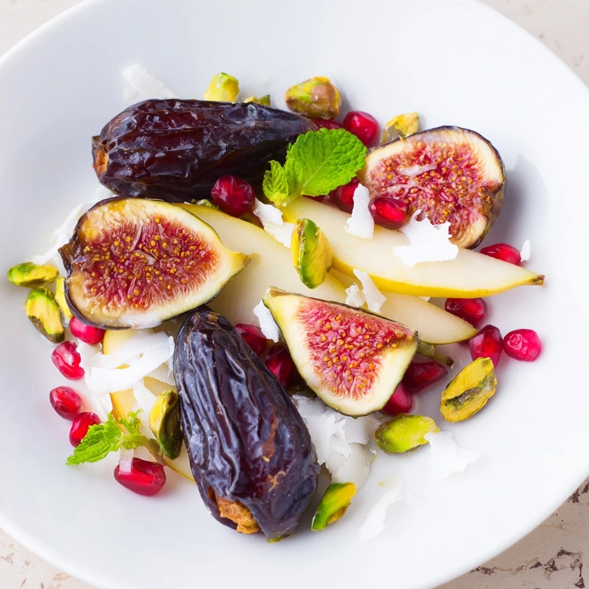 Delicious Winter Fruit: Fig and Date Snowdrift Platter ready to serve, with pomegranate seeds and pistachios.