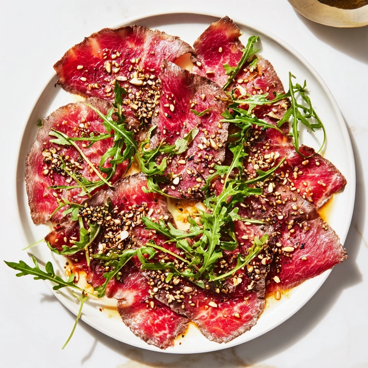 Thinly sliced beef, folded into unique shapes, glistens with marinade; a beautiful Origami Fold Beef Appetizer.