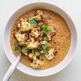 Golden cumin-roasted cauliflower and creamy red lentil dhal, a hearty and aromatic vegetarian dinner served warm.