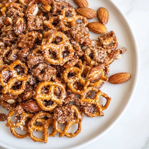 Golden-brown Festive Pine Cone Snack Mix, a perfect blend of sweet and salty for holiday snacking.