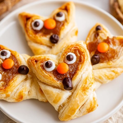 Golden-brown Autumn Harvest Fox-Shaped Bites, filled with spiced apples, and ready to share for your autumn feast.