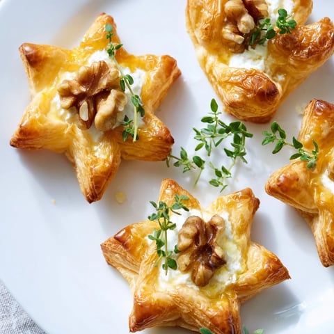 Golden-brown Starry Night New Years Appetizers sparkle with edible glitter and creamy toppings.