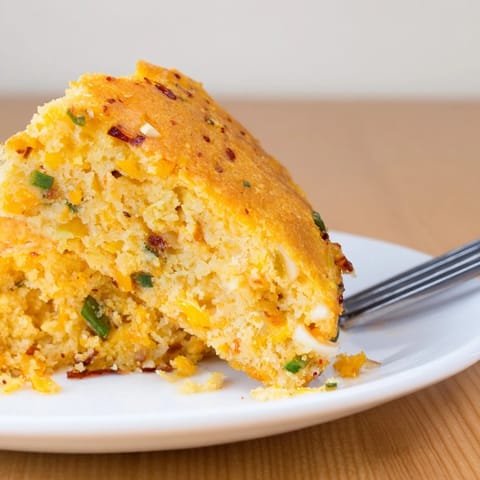 Savory pumpkin pancake scones infused with spicy garlic and chili flavors, ideal snack.  
