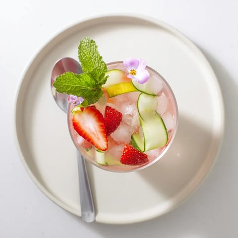 Vibrant mocktails featuring flavored water enhancers and cooling cucumber slices.  