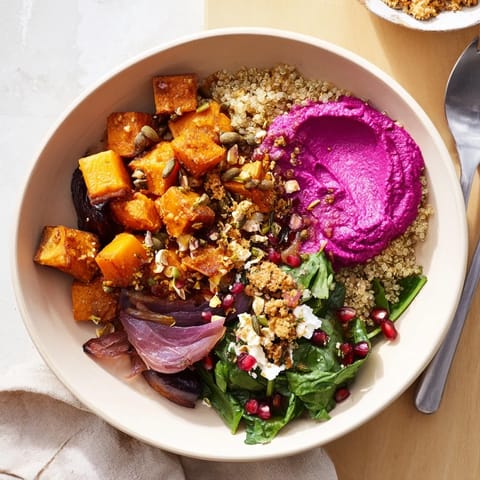 Vibrant, hearty spiced winter bowls topped with pistachio-maple crumble and fresh greens.  