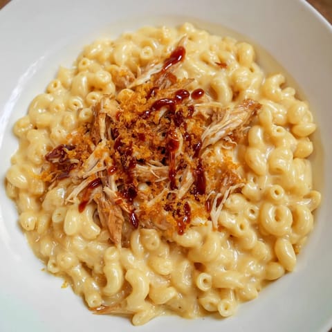 Delicious Classic Mac & Cheese with BBQ Chicken, a family favorite brimming with cheesy, saucy goodness.