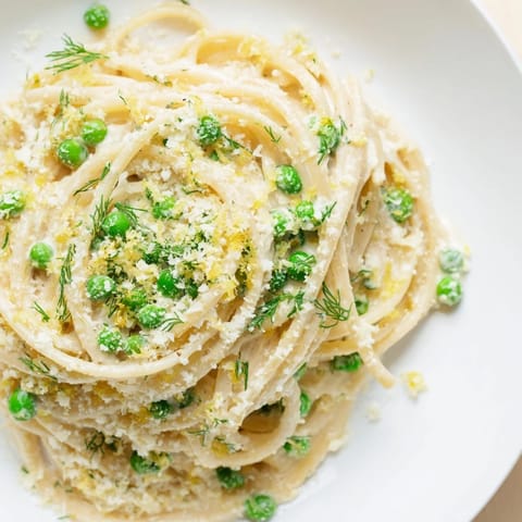Golden Creamy Dill Pasta with bright green herbs, perfect for a cozy, comforting, vegetarian dinner idea.