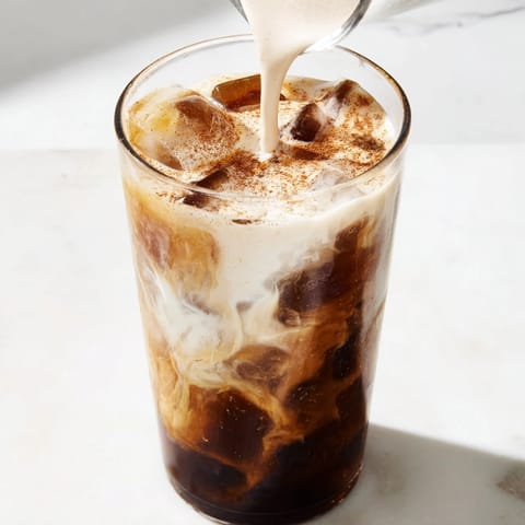 This homemade Proffee Power Blend features a swirl of coffee and chocolate protein, ice cold.