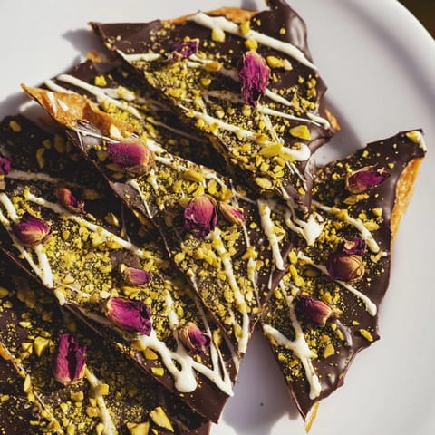 Indulge in a homemade treat: the delightful Pistachio Dubai Chocolate Bark, ready to break and enjoy.
