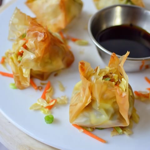 Savory Crispy Rice Paper Dumplings, freshly pan-fried and calling for a satisfying crunch.