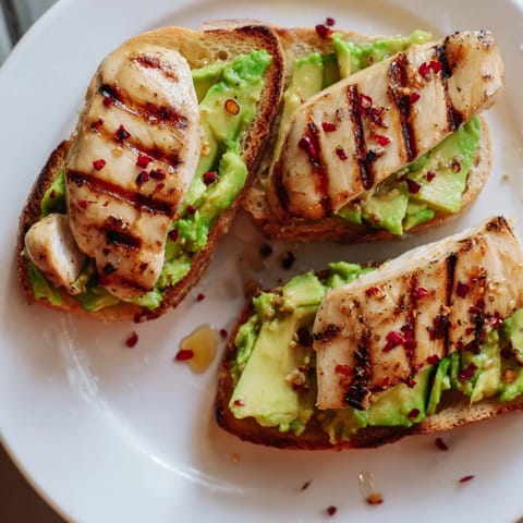 Perfect for a quick brunch, this Smashed Avocado Chicken Toast balances savory and sweet flavors in every bite.  