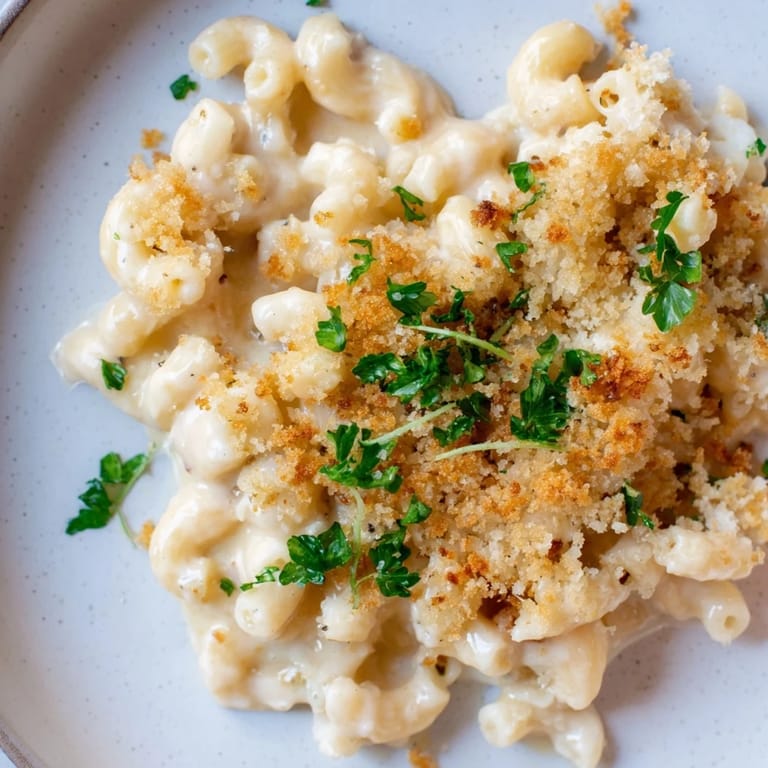 Rich and decadent Truffle Macaroni & Cheese, ready to serve, with a toasted breadcrumb topping.