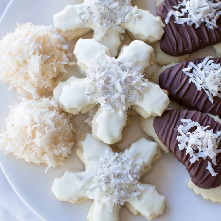 This festive Snowflake Dessert Board presents an array of sweets, perfect for any winter party's dessert table.