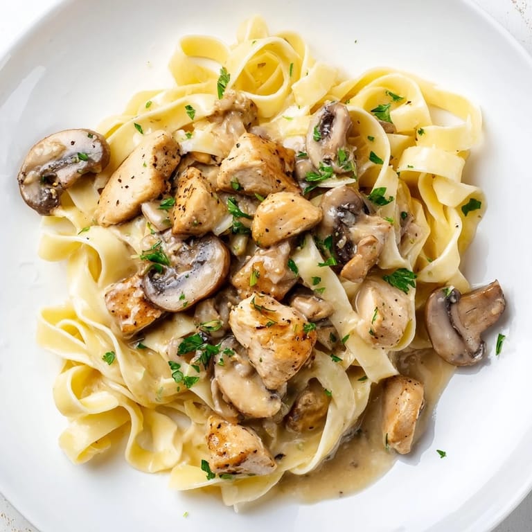 Imagine a close-up: flavorful Creamy Mushroom Chicken Pasta, creamy and rich, ready to enjoy.