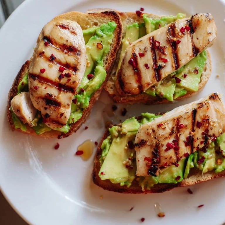Perfect for a quick brunch, this Smashed Avocado Chicken Toast balances savory and sweet flavors in every bite.  